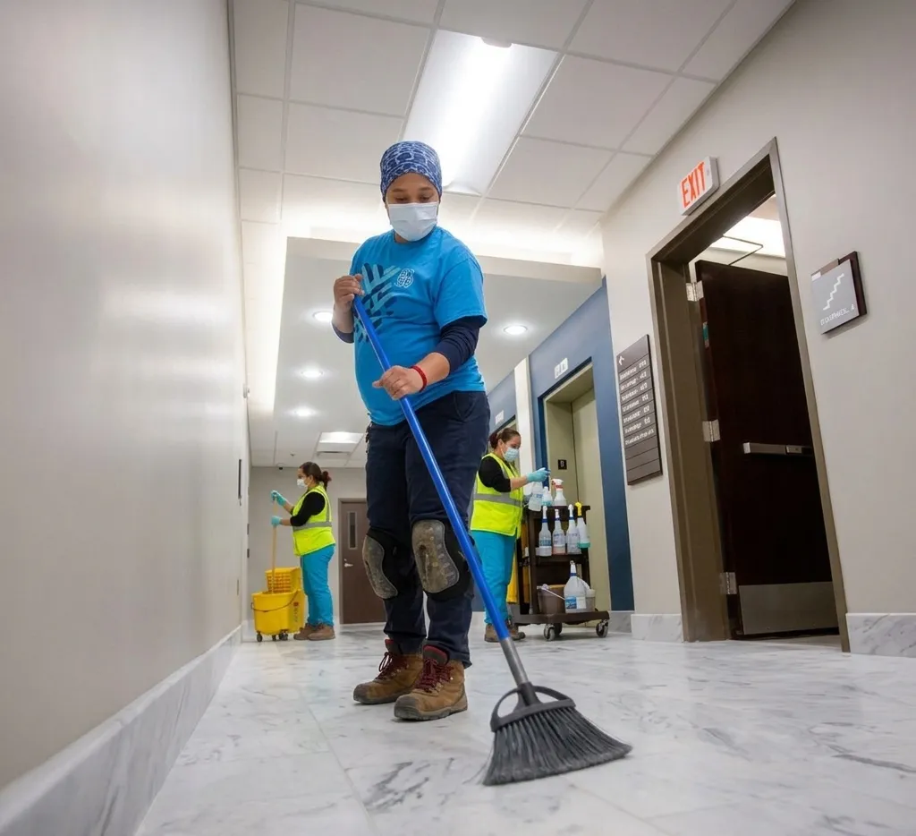 Noble Cleaning Solutions crew performing commercial floor cleaning in a Greensboro office building