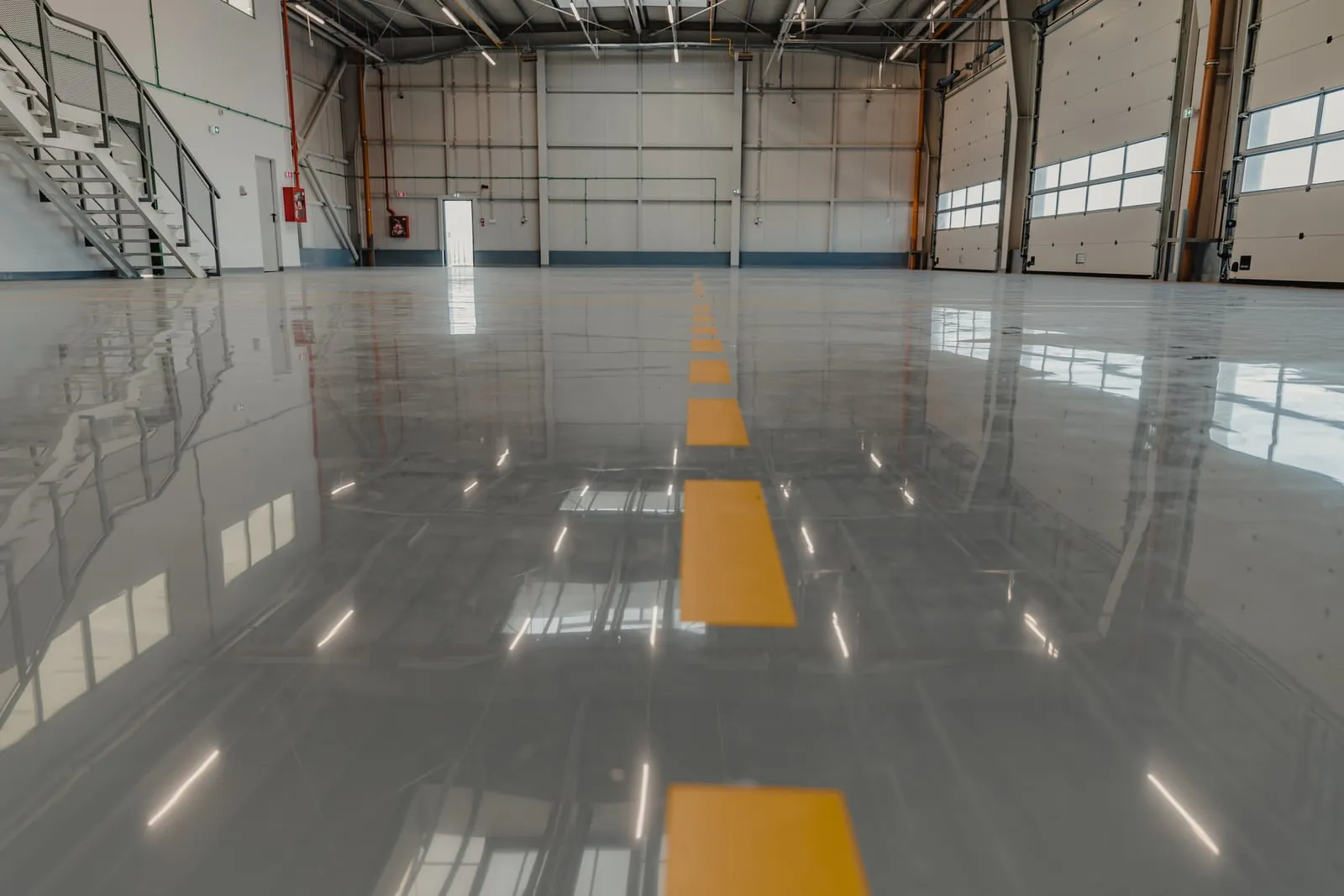 Polished commercial floor reflecting overhead lights